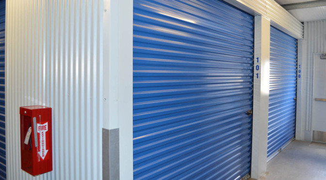 Two large indoor storage units with blue doors