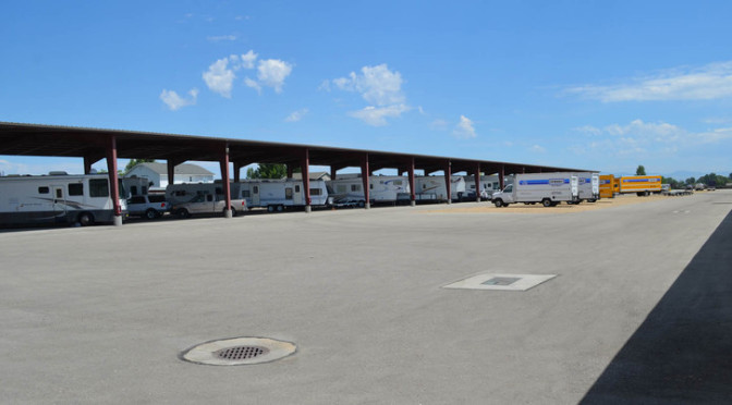 A large outdoor RV, car, and truck parking lot