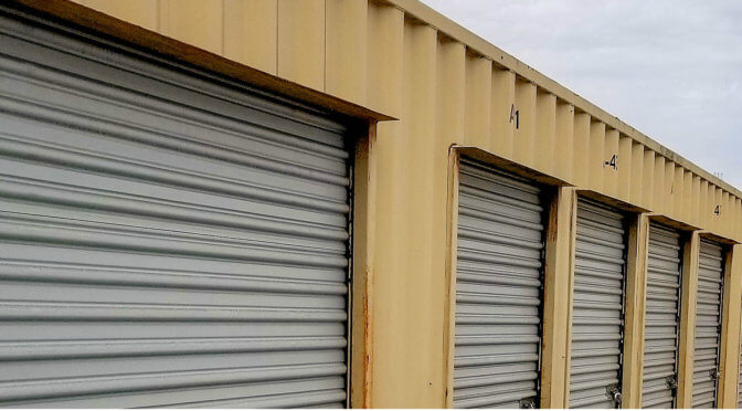 View of outdoor storage units with gray doors
